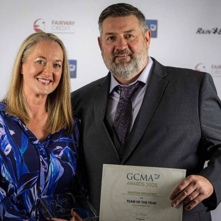 Chad and Lisa with their team of the year award