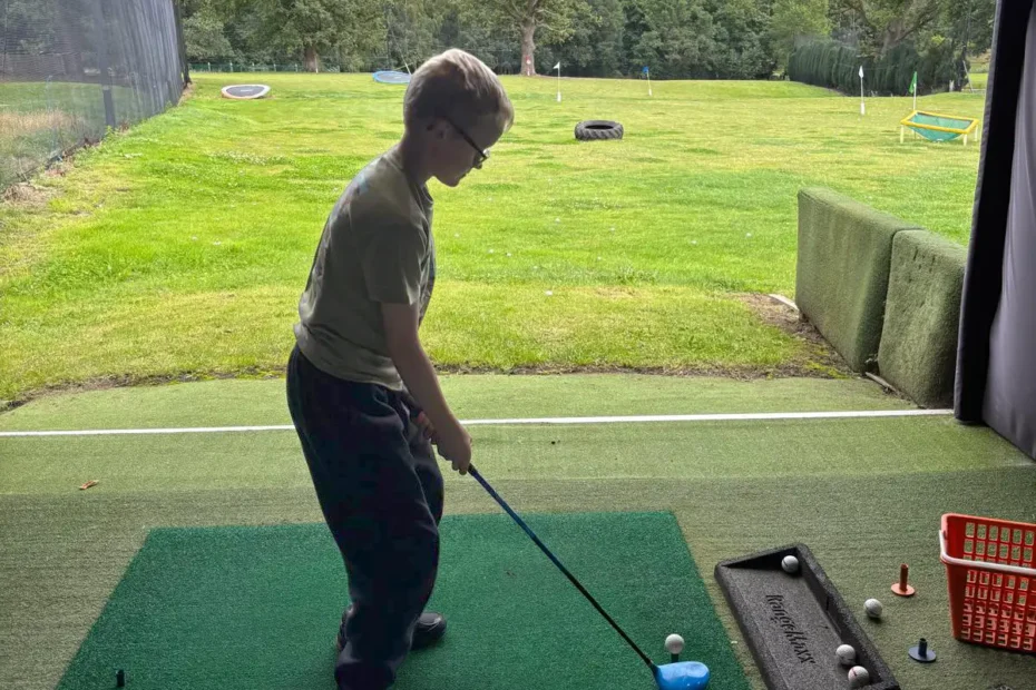 Junior golfer on the practice range